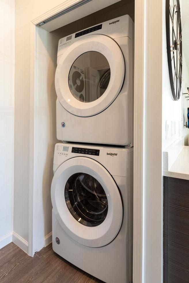 Laundry room with dryer and washing machine.